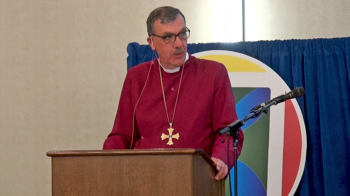 Bishop Ely at podium